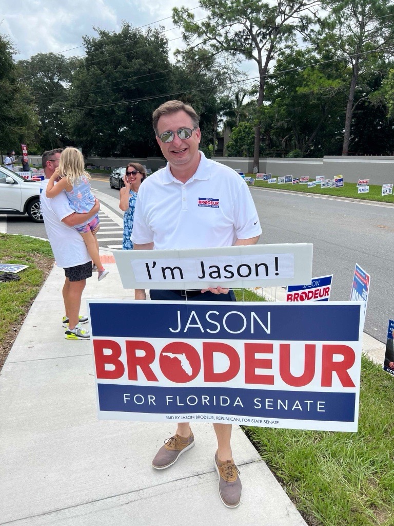 Jason Brodeur with yard sign